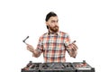 The young bearded man hold a repair tools Royalty Free Stock Photo