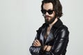 Young bearded man in leather. Hipster in sunglasses Royalty Free Stock Photo