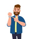 Young bearded man pointing or showing time on his wrist watch. Male character design illustration. Trendy person standing isolated