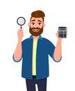 Young bearded man showing or holding digital calculator device and magnifying glass magnifier in hand. Modern lifestyle.