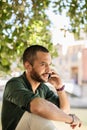 Young bearded man talking over phone Royalty Free Stock Photo