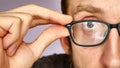 Close-up of the face of a man trying on the glasses