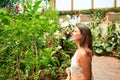 Young beatiful woman smiling happy and cheerful at butterfly garden on a sunny day of summer Royalty Free Stock Photo