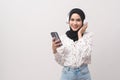 Young beautifu muslim woman wearing headset on white background
