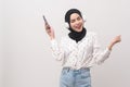 Young beautifu muslim woman wearing headset on white background