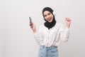 Young beautifu musliml woman wearing headset on white background