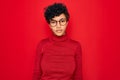 Young beautiful african american afro woman wearing turtleneck sweater and glasses Relaxed with serious expression on face Royalty Free Stock Photo