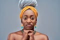 Young beautiful african american woman with afro braids over isolated grey background looking confident at the camera with hands