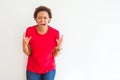 Young beautiful african american woman over white background shouting with crazy expression doing rock symbol with hands up Royalty Free Stock Photo