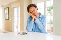 Young beautiful african american woman sleeping tired dreaming and posing with hands together while smiling with closed eyes Royalty Free Stock Photo