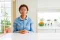 Young beautiful african american woman wearing glasses with serious expression on face Royalty Free Stock Photo