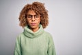 Young beautiful african american woman wearing turtleneck sweater and glasses Relaxed with serious expression on face Royalty Free Stock Photo