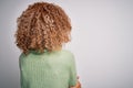 Young beautiful african american woman wearing turtleneck sweater and glasses standing backwards looking away with crossed arms Royalty Free Stock Photo