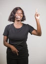 Young beautiful afro American woman coaching at seminar - happy and successful black businesswoman with headset speaking giving Royalty Free Stock Photo