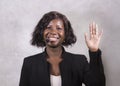 Young beautiful afro American woman coaching at seminar - happy and successful black businesswoman with headset speaking giving Royalty Free Stock Photo