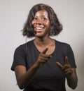 Young beautiful afro American woman coaching at seminar - happy and successful black businesswoman with headset speaking giving Royalty Free Stock Photo