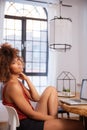 Young Afro American woman using laptop computer while sitting at table. Royalty Free Stock Photo