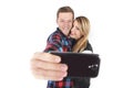 Young beautiful American couple in love taking romantic self portrait selfie photo together with mobile phone Royalty Free Stock Photo