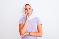 Young beautiful arabian girl wearing hijab standing over isolated white background thinking looking tired and bored with