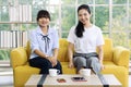 Young and beautiful Asain women sitting and smiling to camera