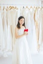 Young beautiful asian bride woman in white dress with hand holding model heart red color,Happy and smiling Royalty Free Stock Photo