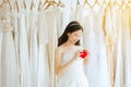 Young beautiful asian bride woman in white dress with hand holding model heart red color,Happy and smiling Royalty Free Stock Photo