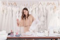 Young beautiful Asian business owner women happy working in wedding boutique showroom , Attractive dressmaker concentrate design Royalty Free Stock Photo