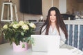 Young Beautiful Asian business woman working online with laptop computer placed at the table at home office. Smiling Royalty Free Stock Photo