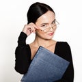 Young beautiful Asian businesswoman wearing eyeglasses with folder for papers Royalty Free Stock Photo
