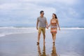 young beautiful Asian Chinese couple walking together on the beach happy in love enjoying holidays and relax smiling joyful in Royalty Free Stock Photo