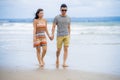 young beautiful Asian Chinese couple walking together on the beach happy in love enjoying holidays and relax smiling joyful in Royalty Free Stock Photo