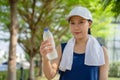 Young beautiful asian drinking water after jogging running outdoor. Healthy and active lifestyle concept Royalty Free Stock Photo