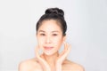 Young beautiful asian girl with clean skin, Cosmetic Beauty Concept,hands touch on the cheek, smiling and friendly face isolated o Royalty Free Stock Photo