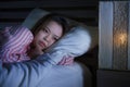 Young beautiful Asian Korean girl lying on bed late night awake looking thoughtful suffering insomnia sleeping disorder feeling Royalty Free Stock Photo