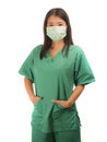 Young beautiful Asian Korean medicine doctor woman or hospital nurse in scrubs using protective medical face mask in prevention Royalty Free Stock Photo