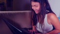 Young beautiful Asian Korean student girl happy and relaxed at home sofa couch using internet on laptop computer networking cheerf Royalty Free Stock Photo