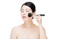 Young beautiful asian model makeup foundation being brushed on f Royalty Free Stock Photo