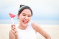 Young beautiful Asian smiling happy woman travels to the sea on vacation.