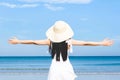 Young beautiful asian woman on the beach,standing running sitting lying with hat white dress swimwear green orange sunglasses sky Royalty Free Stock Photo