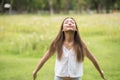 Young woman breathe fresh air in spring park