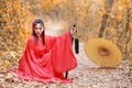 Beautiful asian woman dress in traditional Chinese old fashion warrior style with ancient word and umbrella. Cute girl in Royalty Free Stock Photo