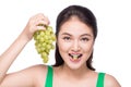 Young beautiful asian woman eating fresh grapes isolated on whit Royalty Free Stock Photo