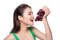 Young beautiful asian woman eating fresh grapes isolated on whit Royalty Free Stock Photo