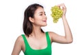 Young beautiful asian woman eating fresh grapes isolated on whit Royalty Free Stock Photo