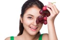 Young beautiful asian woman eating fresh grapes isolated on whit Royalty Free Stock Photo