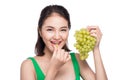 Young beautiful asian woman eating fresh grapes isolated on whit Royalty Free Stock Photo