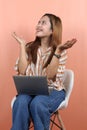 Young beautiful asian woman holding digital tablet and laptop