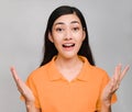 Young beautiful asian woman,long black hair, wore orange t shirt,Showing distrust,suspicious, skeptical, sceptical,Surprise on Royalty Free Stock Photo