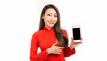 Young beautiful Asian woman pointing at black empty space on smart phone background can use for advertising or product presenting Royalty Free Stock Photo
