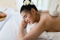 Young beautiful Asian woman relaxing in the spa massage Royalty Free Stock Photo